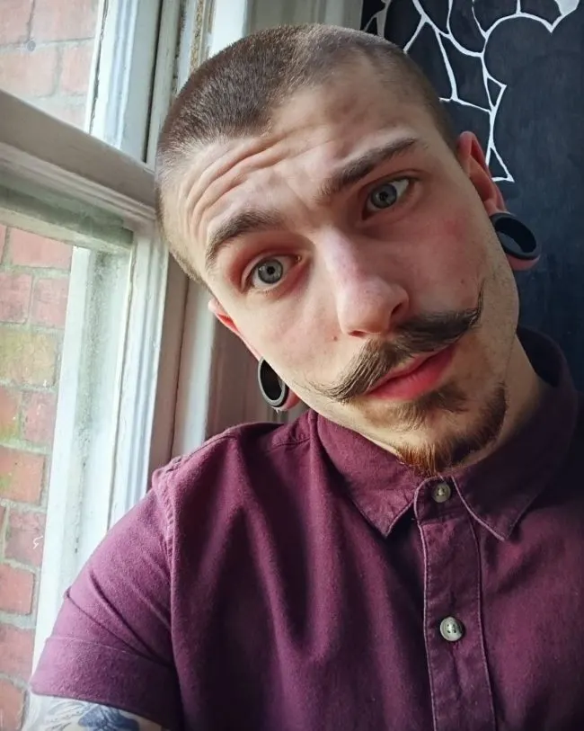 Thick Mustache with a Short Haircut