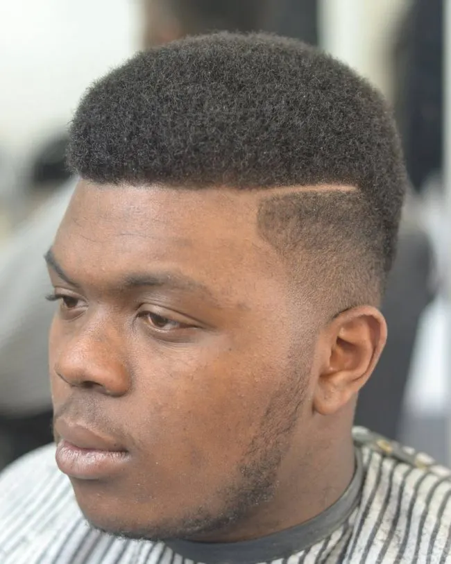 Medium Size Afro with Side Part and Fade