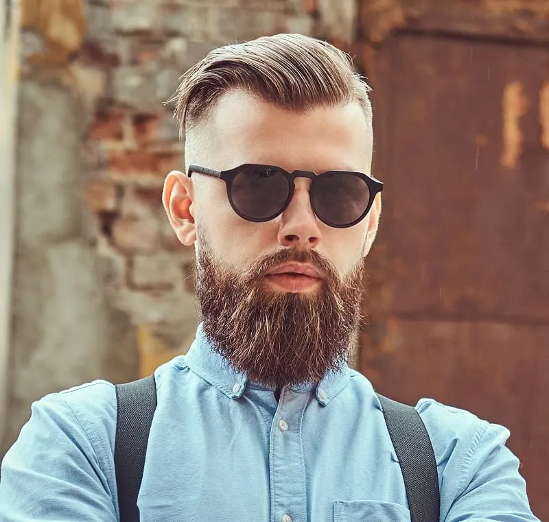 hipster guy with comb over fade haircut