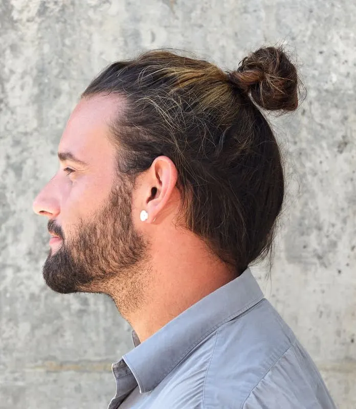 guy with top knot hair